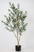 Realistic faux olive tree styled for a warm living room interior